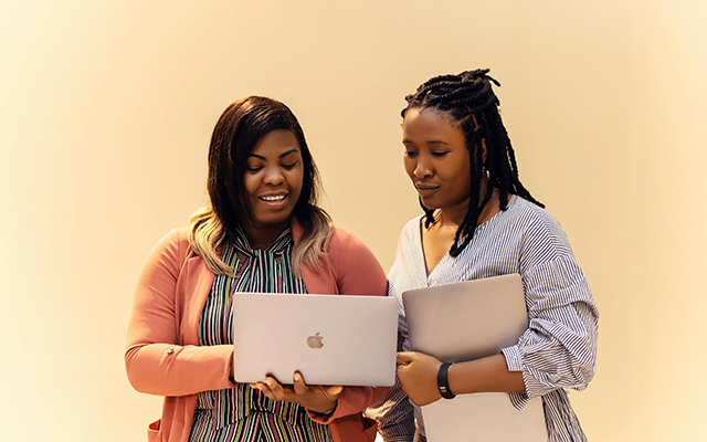Two women collaborating within a tech hub in Lagos.